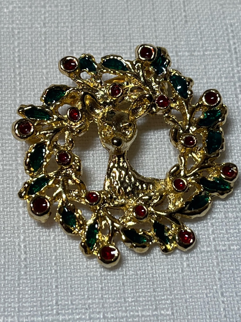 Gold-tone Reindeer Wreath Brooch with Green and Red Accents